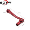 A red CNC aluminum folding gear shift lever for motorcycles and dirt bikes.