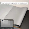 A rolled premium PU leather desk mat in light gray showing various dimensions for reference.