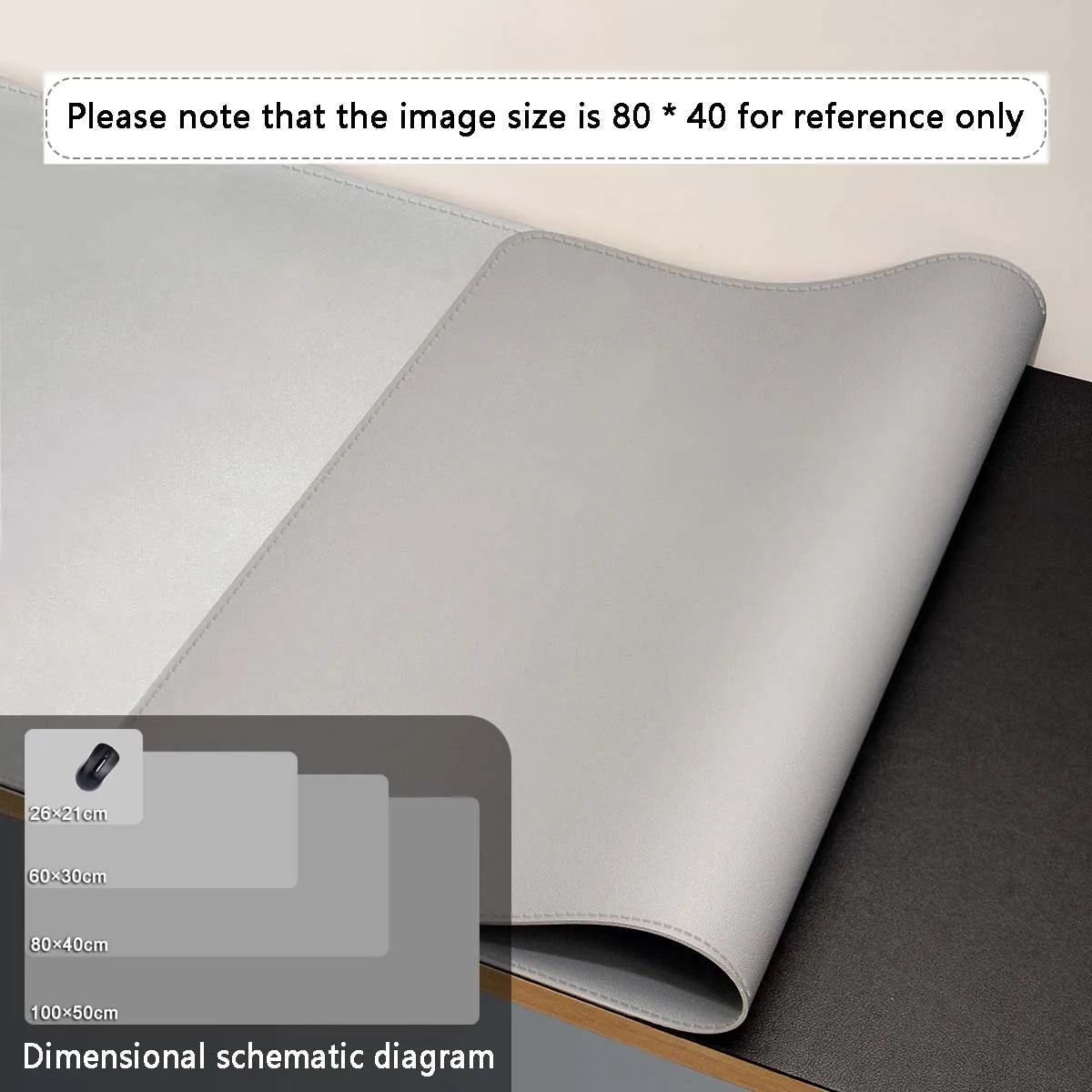 A rolled premium PU leather desk mat in light gray showing various dimensions for reference.