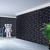 Modern geometric patterned wallpaper on a wall with a white figure and striped floor.