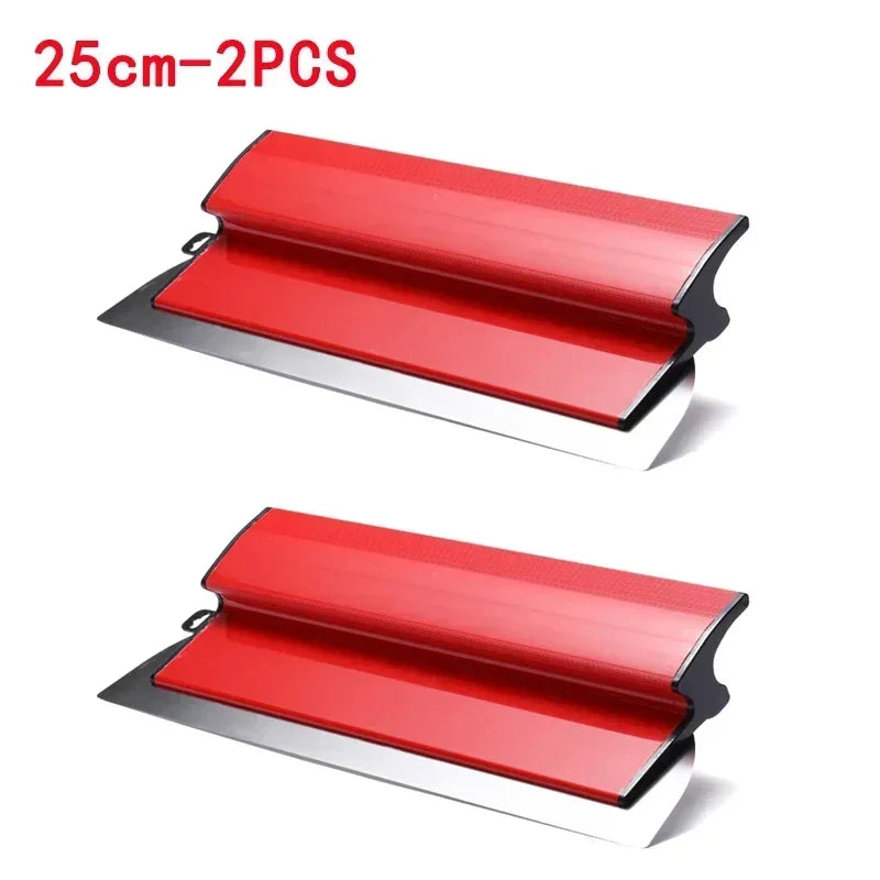 Two red skimming blades with stainless steel edges for smooth wall finishing