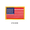 A rectangular embroidered patch of the American flag featuring blue stars and stripes on a yellow fabric background.