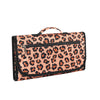 A portable leopard print foldable waterproof baby changing pad with a handle.