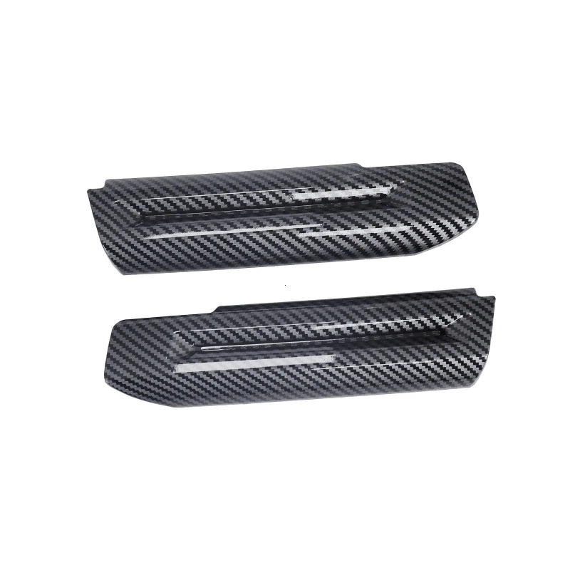 Black carbon fiber door handle covers for a Ford Mustang