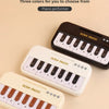 Three mini electronic keyboard pianos in black and white are displayed on a light background.