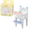 A white wooden baby chair for Sylvanian Families figures, packaged in a cardboard box.