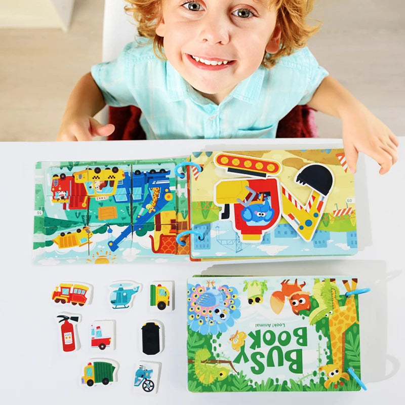 A child holds an open book featuring colorful illustrations and letters for a busy book activity.