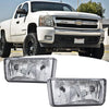 A close-up view of a white pickup truck with an aftermarket front bumper fog light assembly kit installed.