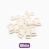 A collection of white plastic side-release buckles for paracord bracelet projects.
