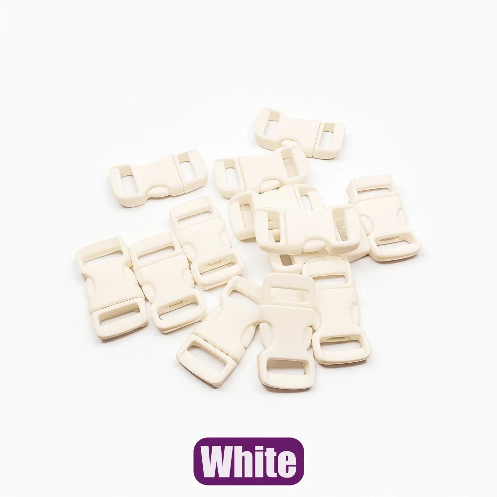 A collection of white plastic side-release buckles for paracord bracelet projects.