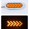 A 6-inch oval LED trailer tail light with a dynamic amber arrow turn signal mounted on a white base.