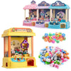 A colorful mini claw crane machine for kids with lights and music, featuring various toys and a pink and blue facade.