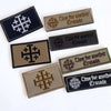 A collection of embroidered tactical patches featuring the Knights Templar cross design in various shades of gray and black.