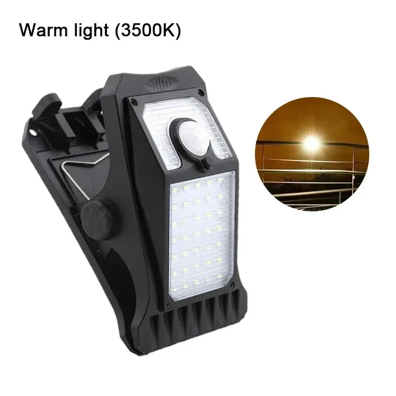 A black solar clip-on outdoor light with a warm white LED and motion sensor, shown next to its circular light output.