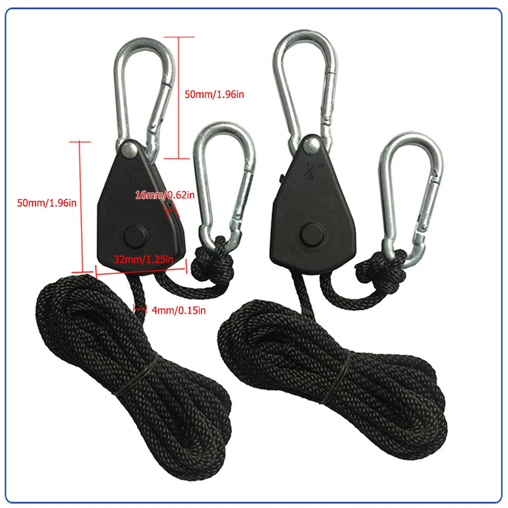 Two black camping tent rope tensioners with ratchet pulley hooks and thick black rope.