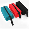 Three compact tool organizer bags in teal, red, and black fabric displayed on a white background.