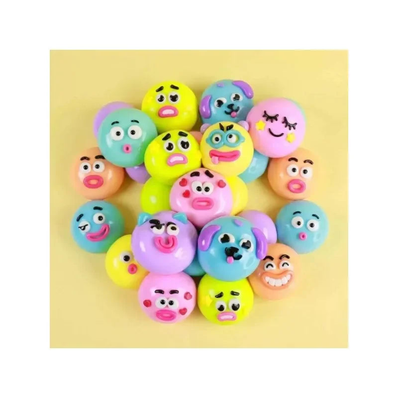A collection of colorful face-changing stress relief squishy toys in various pastel colors.