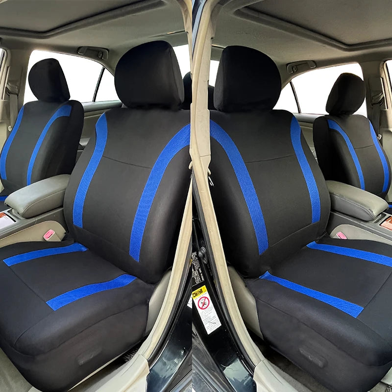 A pair of black and blue two-tone car seat covers shown in the interior of a vehicle.