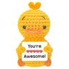 Handmade crochet orange hedgehog doll with a card that says You're Awesome!