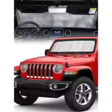 Red Jeep Wrangler windshield sunshade installed on a vehicle interior.