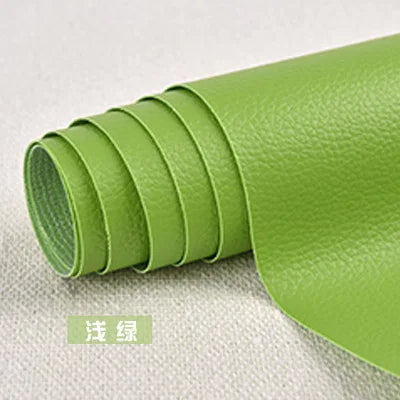 A roll of lime green self-adhesive PU leather patch for furniture and craft repairs.