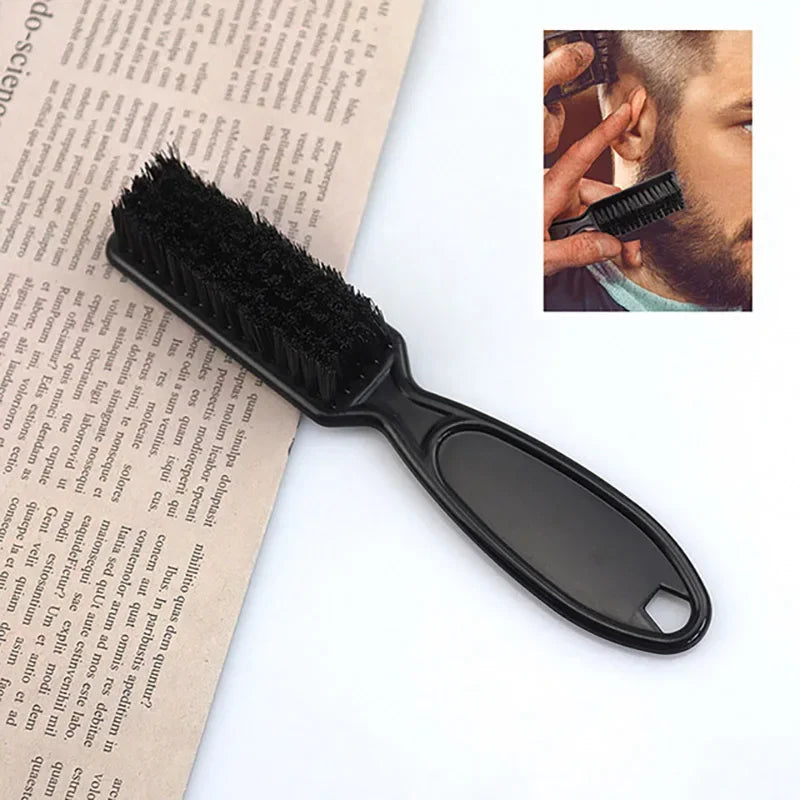 A black professional grooming brush used for styling wigs and beards, shown next to a close-up of a hand using a similar brus