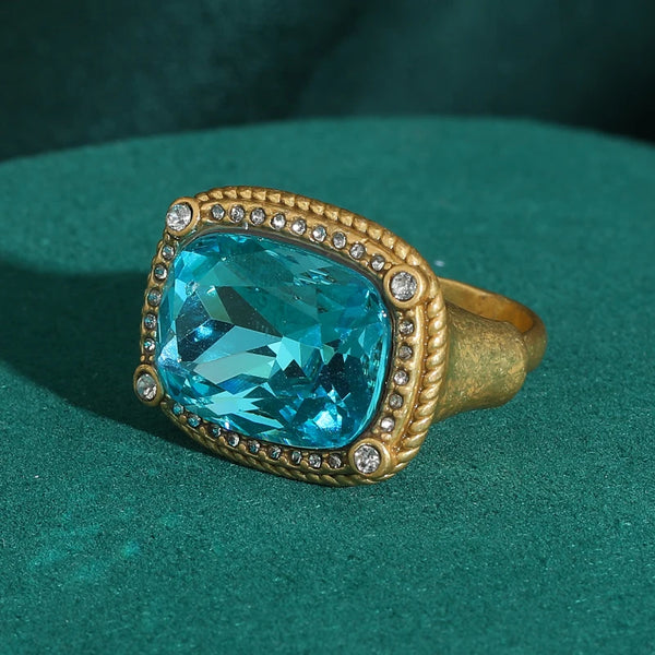 Vintage sea blue crystal cocktail ring set in gold with pave diamonds