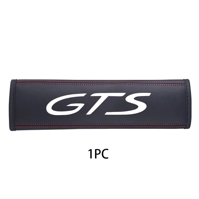 Black leather seat belt cover with white GTS logo on a white background