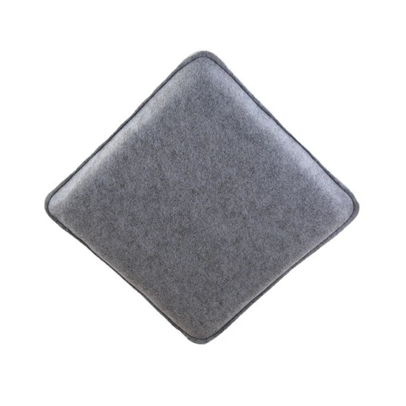 A square, gray needle felting mat for wool crafting.