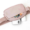 A light pink adjustable nylon waist pack with a zippered phone pocket and a white earbud visible.