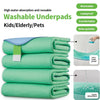 Stack of green washable underpads used for kids, elderly, or pets