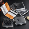 A collection of classic stainless steel cigarette cases with embossed patterns and orange accents.