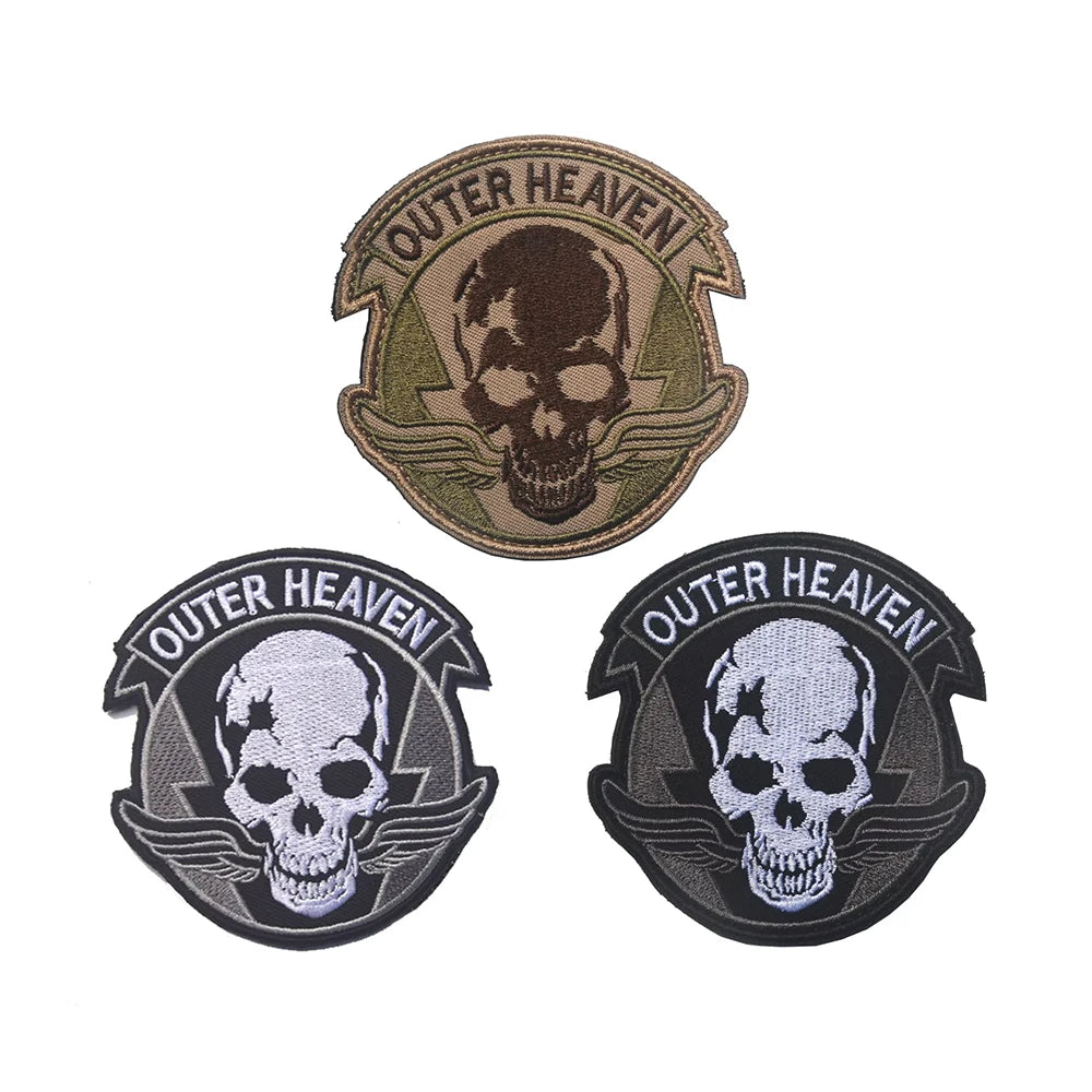Embroidered patch featuring a skull design with the text Outer Heaven on a dark background.