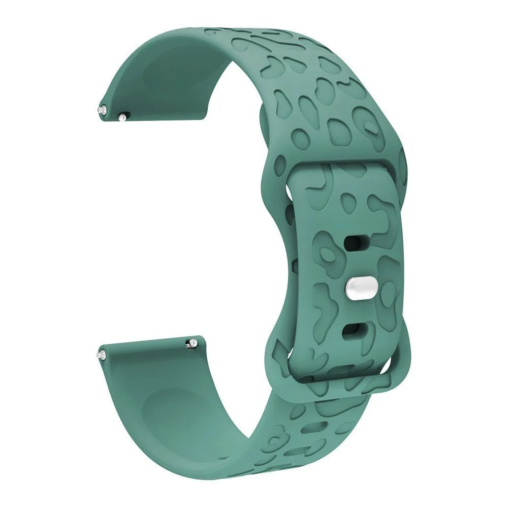 A teal silicone watch band with an engraved pattern for a Redmi Watch 5.