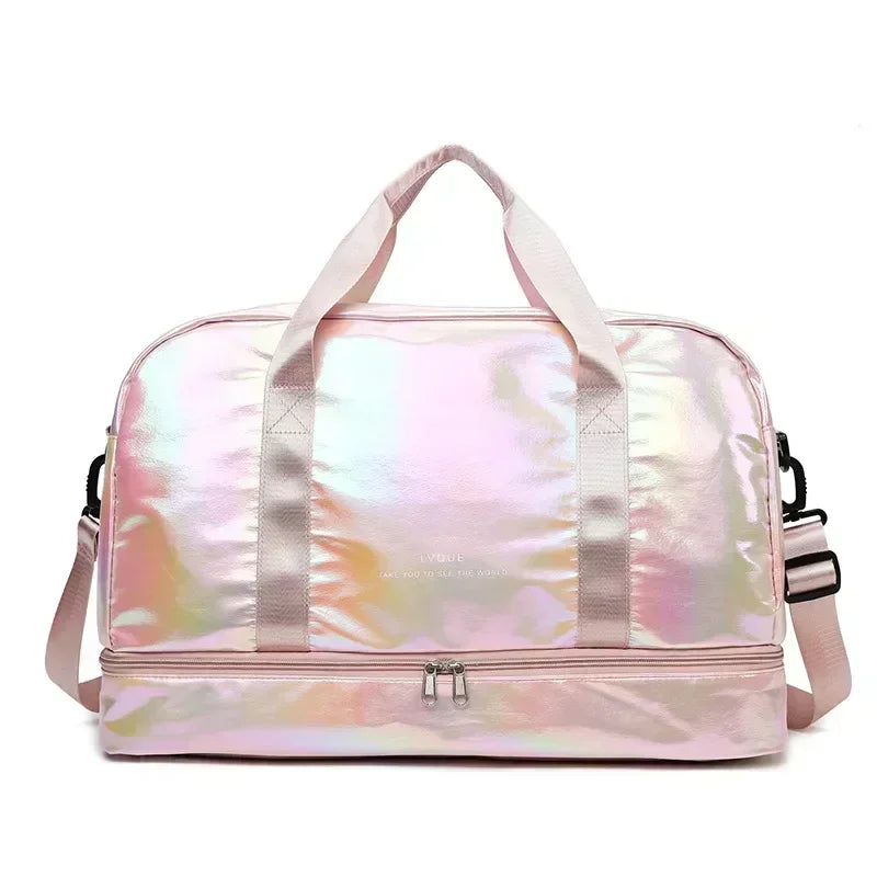 A pink iridescent travel duffel bag with pink fabric handles and a zipper closure.