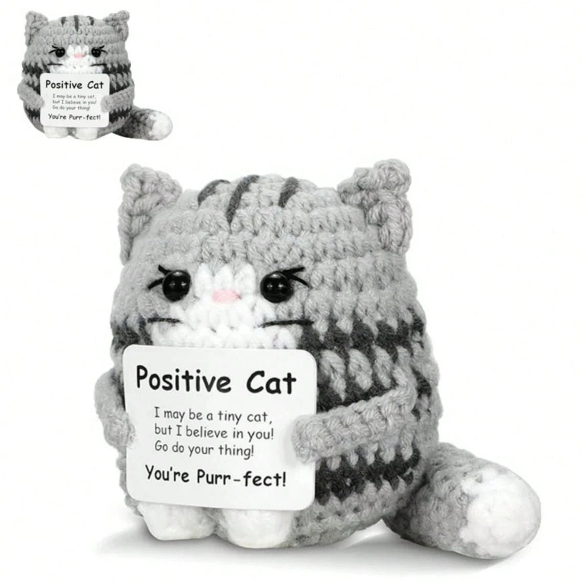 A gray knitted cat figurine with an inspirational card that reads Positive Cat You're Pure-fect