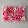 A dense wall panel of pink and white silk rose flowers for weddings and events.