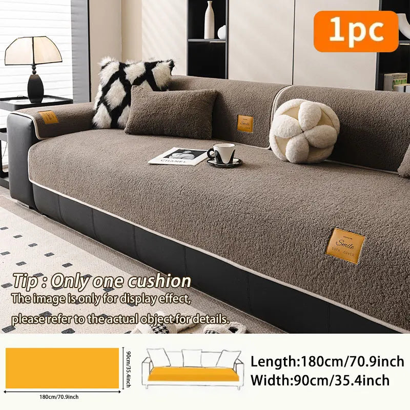 A cozy anti-slip lamb fleece sofa mat in brown color shown on a sofa.