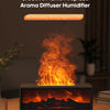 A black fireplace aroma diffuser humidifier is shown glowing with bright orange flames on a wooden surface.
