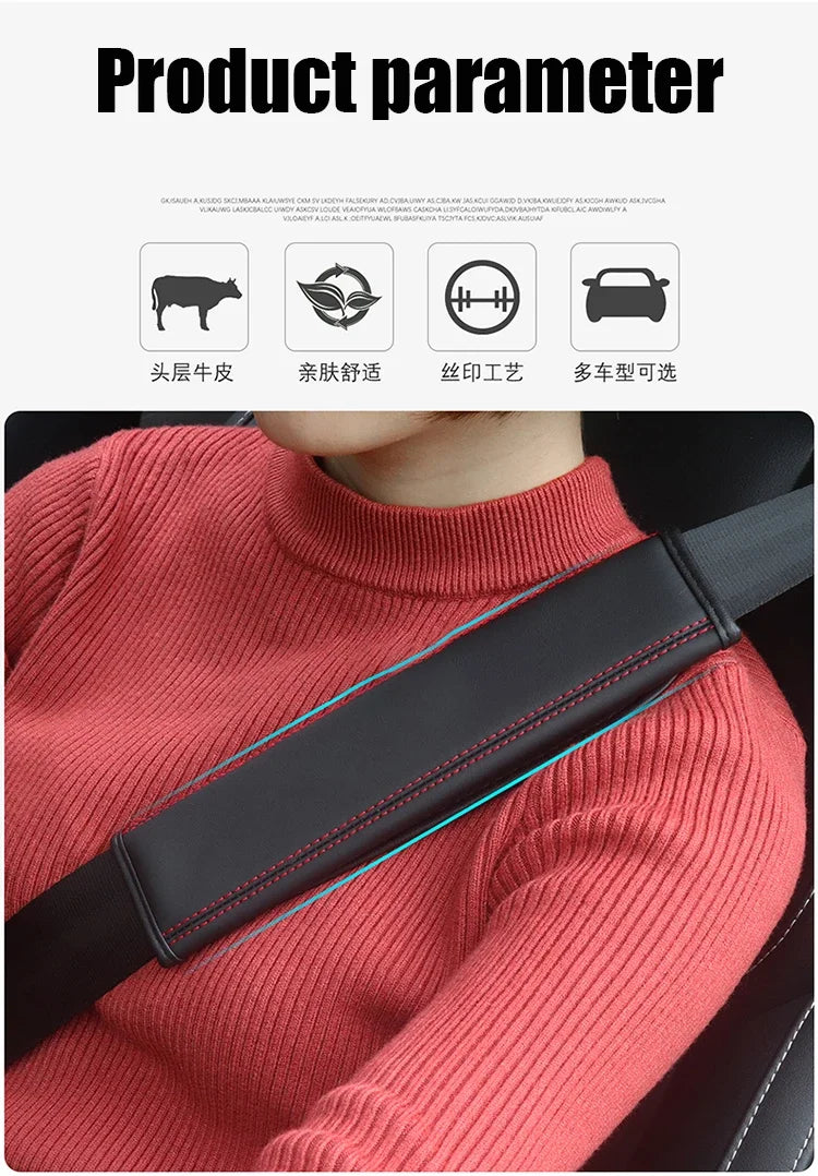 A close-up of a person wearing a black leather seat belt cover on a pink sweater, showing the strap detail.