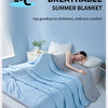 A light blue breathable summer blanket is draped over a person lying on a bed, emphasizing comfort.