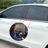 Close-up view of a car window with a mesh sun shade cover installed, showing a person looking through the glass.
