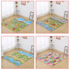 A colorful soft foam baby play mat featuring various animals and nature scenes on a wooden floor.
