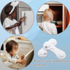 Close-up of adhesive baby proof cabinet locks used to secure drawers and cupboards for child safety.