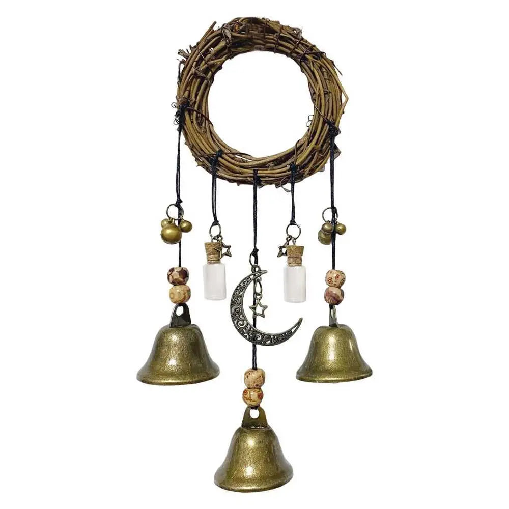 A rustic witch bells door hanger wind chime made of woven branches and brass bells.