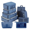 A set of blue travel packing cubes and storage organizer bags stacked and laid out.