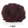 A ball of dark brown chunky chenille yarn used for knitting and crochet