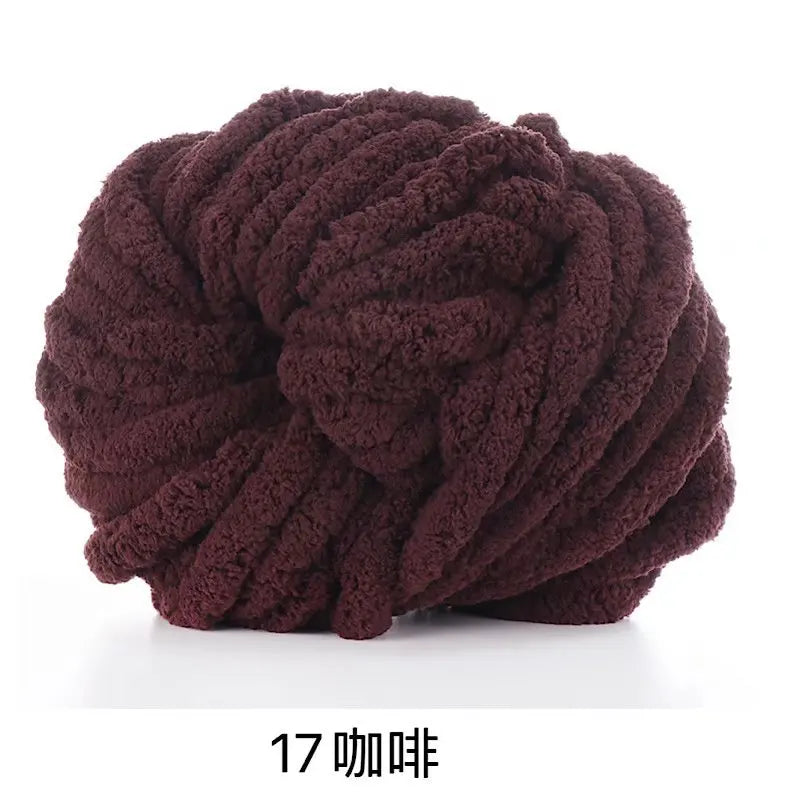 A ball of dark brown chunky chenille yarn used for knitting and crochet