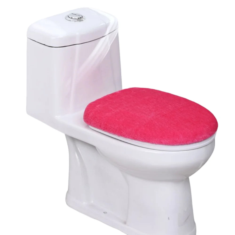 A white toilet with a bright pink flannel seat cover installed.