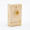 A rectangular box of The Classic Tarot card deck and guidebook with a light beige background and gold celestial design.